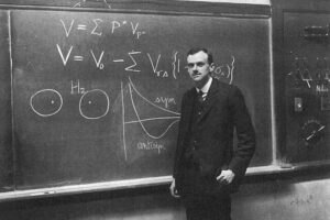PAM Dirac infront of blackboard